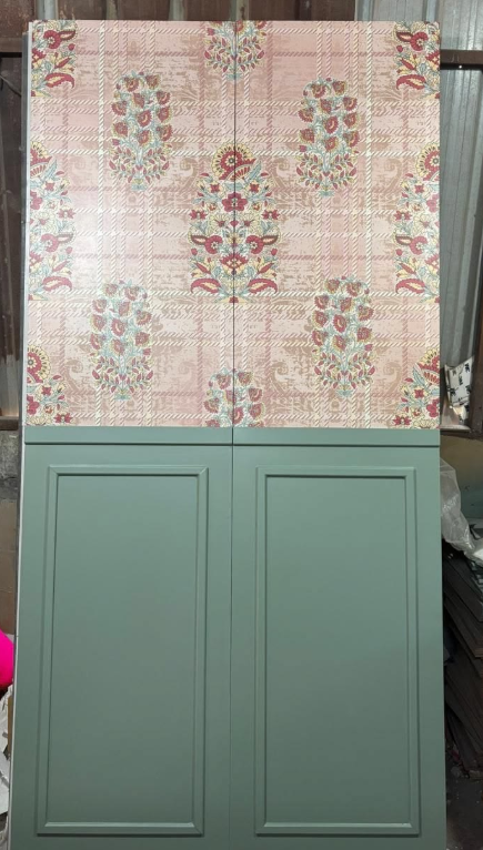 Floral panel over sage cabinets